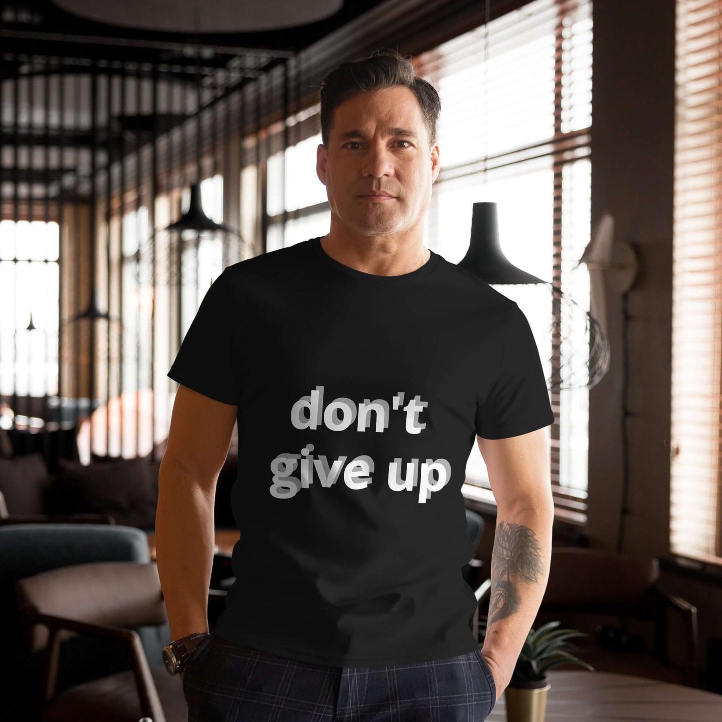 Motivational t-shirt with "don't give up" slogan, 100% premium cotton.