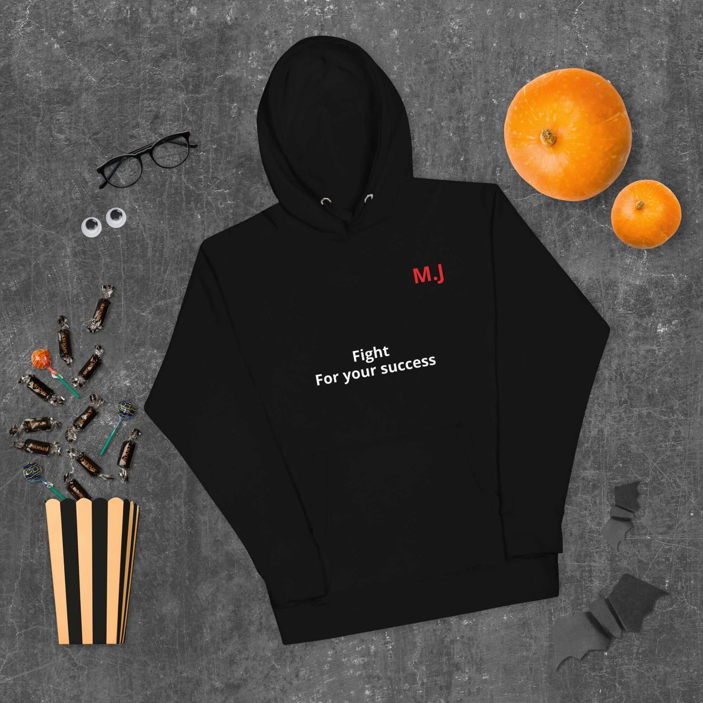 Unisex black hoodie with "Fight For your success" text, featuring a front pocket and matching drawstring.